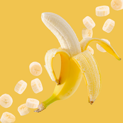 Ripe banana slices arranged on a golden yellow background highlight Wild Desert Sugar Free Dye-FREE Banana Coffee Syrup. Crafted with organic monk fruit and organic non-GMO erythritol by a family-owned business in Tucson, Arizona. This clear-pour, dye-free, sugar-free syrup delivers sweet, smooth banana flavor—perfect for coffee, lattes, teas, smoothies, desserts, and specialty drinks. Keto-friendly, low-carb, and made in small batches for gourmet quality.