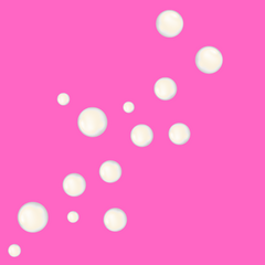 Pink bubble gum candy pieces on a colorful background representing Hypothermias Bubble Gum Sugar Free Dye-FREE Slush Syrup, a nostalgic keto-friendly slush mix with zero net carbs for slush machines and frozen drinks