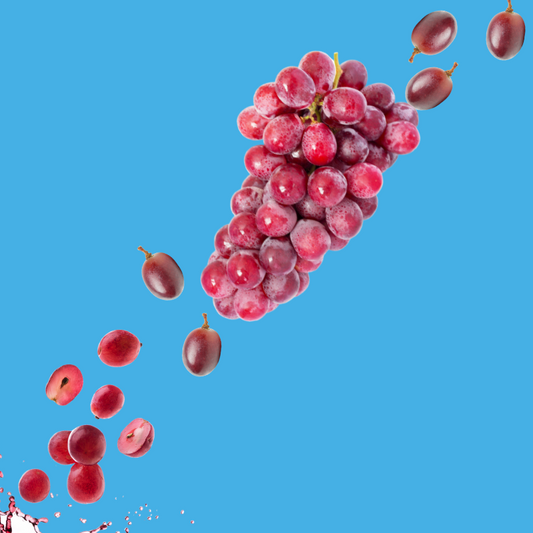 Fresh purple grapes on a vibrant sky blue background representing Grape SUGAR FREE | Dye-FREE Shaved Ice & Snow Cone Syrup. Bold nostalgic grape soda flavor, FREE & Clear, zero net carbs, keto-friendly with monk fruit & erythritol.