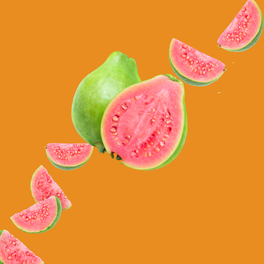 Fresh guava slices on a burnt orange background representing Wild Desert Dye-FREE Guava Coffee Syrup. Made with non-GMO 100% pure cane sugar and crafted in small batches by a family-owned business in Tucson, Arizona. Clear pour, dye-free syrup with a tropical guava flavor featuring hints of strawberry and citrus, perfect for coffee, lattes, teas, smoothies, and specialty drinks.