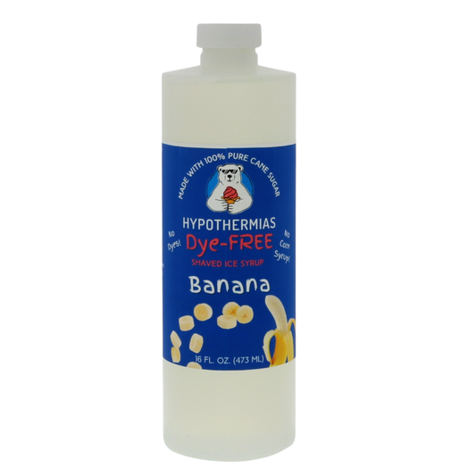 A clear BPA-free plastic pint bottle of Hypothermias Dye-FREE Banana Shaved Ice Syrup made from non-GMO 100% pure cane sugar. The bottle is shown on a white background with a dark blue label featuring a banana image to indicate flavor.