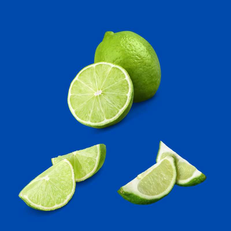A group of fresh limes represents Hypothermias Dye-Free Lime Shaved Ice & Snow Cone Syrup, made with pure cane sugar and no corn syrup or artificial dyes.