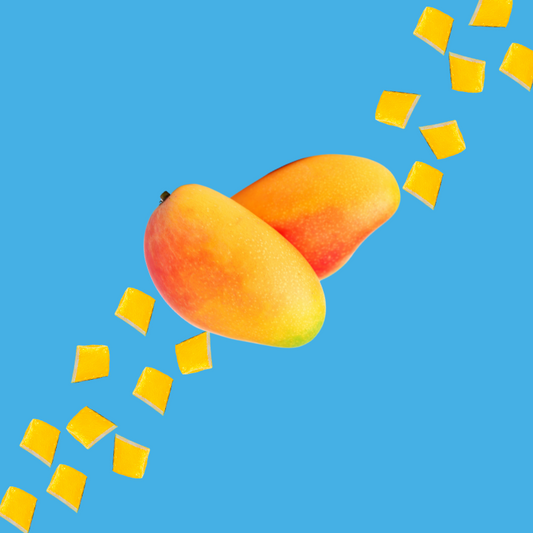 Fresh mango slices on a vibrant sky blue background representing Mango SUGAR FREE | Dye-FREE Shaved Ice & Snow Cone Syrup. Sweet tropical flavor, FREE & Clear, zero net carbs, sugar free, keto-friendly with organic non-GMO monk fruit & erythritol.