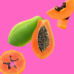 Fresh ripe papaya slices on a vibrant pink background representing Hypothermias Papaya Sugar Free Dye-FREE Slush Syrup, a keto-friendly tropical slush mix with zero net carbs for slush machines and frozen drinks