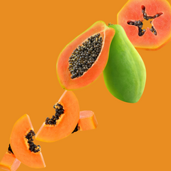 Wild Desert Dye-FREE Papaya Coffee Syrup featured with ripe papaya slices on a warm orange background. Made with non-GMO 100% pure cane sugar and crafted in small batches by a family-owned business in Tucson, Arizona. Clear pour, dye-free syrup with a sweet tropical papaya flavor, perfect for coffee, lattes, teas, smoothies, mocktails, cocktails, and specialty drinks.