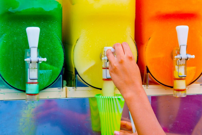 Slushie machine with yellow frozen slush.