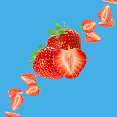 Fresh strawberries on a vibrant sky blue background representing Strawberry SUGAR FREE | Dye-FREE Shaved Ice & Snow Cone Syrup. Classic fruity flavor, FREE & Clear, zero net carbs, sugar free, keto-friendly with organic non-GMO monk fruit & erythritol.