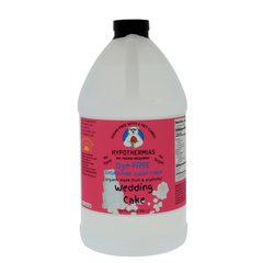 A half-gallon bottle of Hypothermias Sugar-Free & Dye-Free Wedding Cake Slush Syrup with a pink label featuring a tiered white cake, photographed on a bright white background. Crafted in small batches with organic monk fruit and erythritol for a creamy, sugar-free dessert-style syrup.