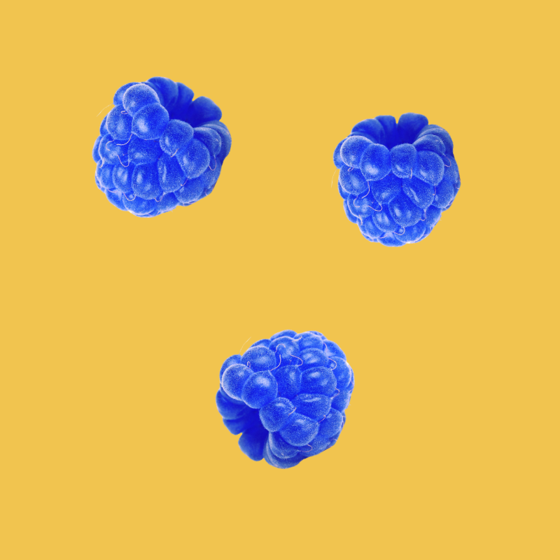 Blue raspberries representing Wild Desert Dye-FREE Blue Raspberry Coffee Syrup made with non-GMO 100% pure cane sugar.