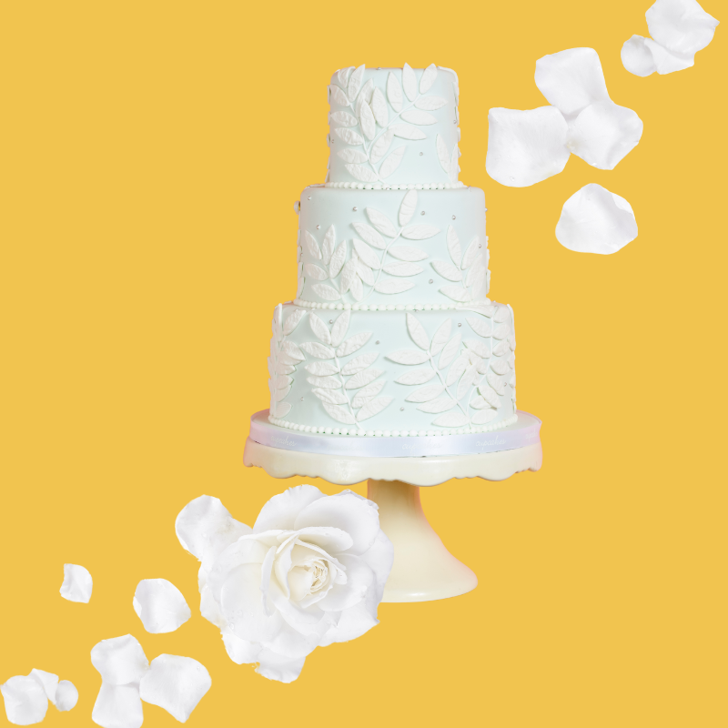 Wedding cake slices on a yellow background representing Wedding Cake SUGAR FREE Dye-FREE Coffee Syrup, made with organic monk fruit & erythritol. Small-batch crafted, keto-friendly, dye-free, and perfect for coffee, lattes, teas, smoothies, and specialty drinks.
