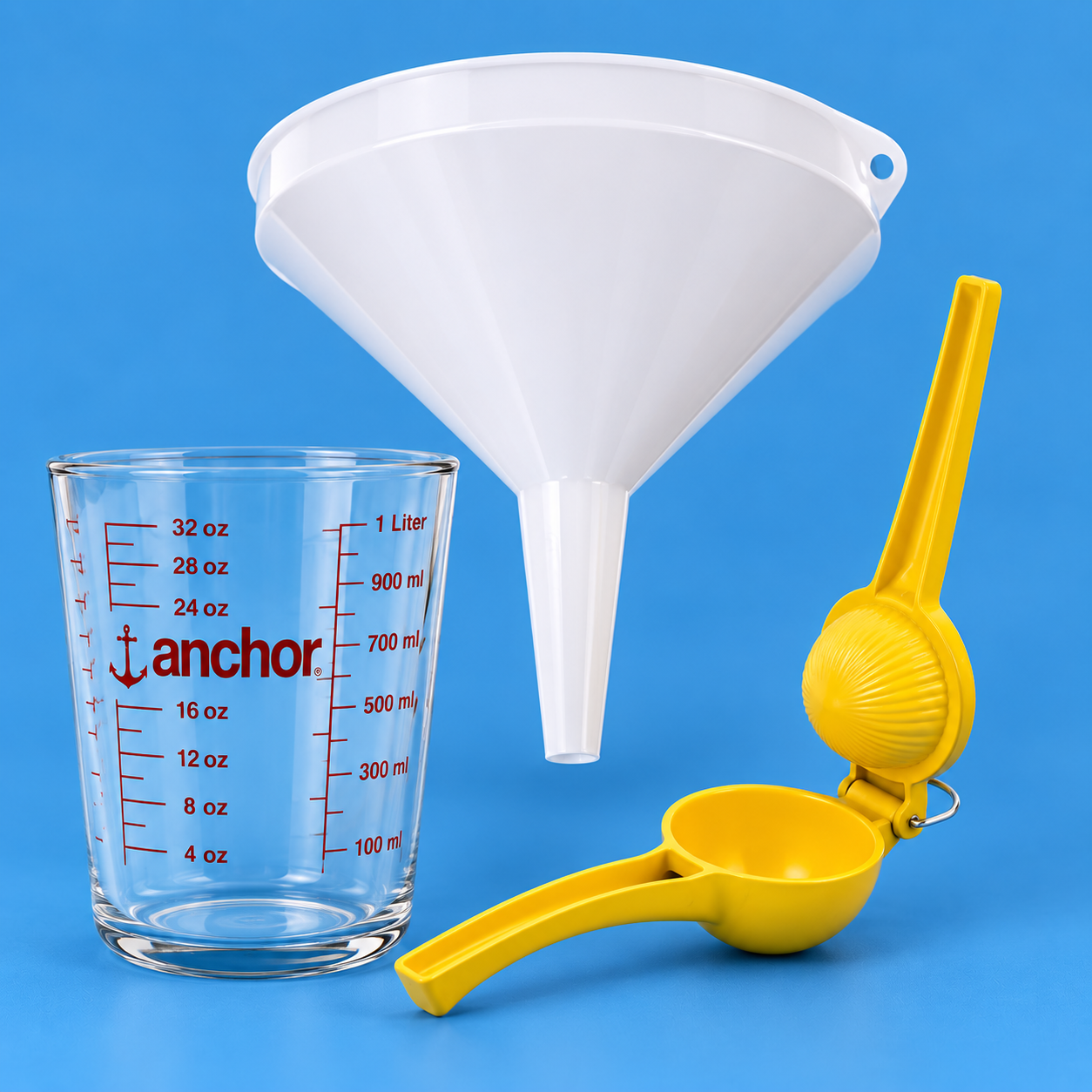 Image showing snow cone mixing supplies which includes funnel, measuring cup, lemon squeezer.
