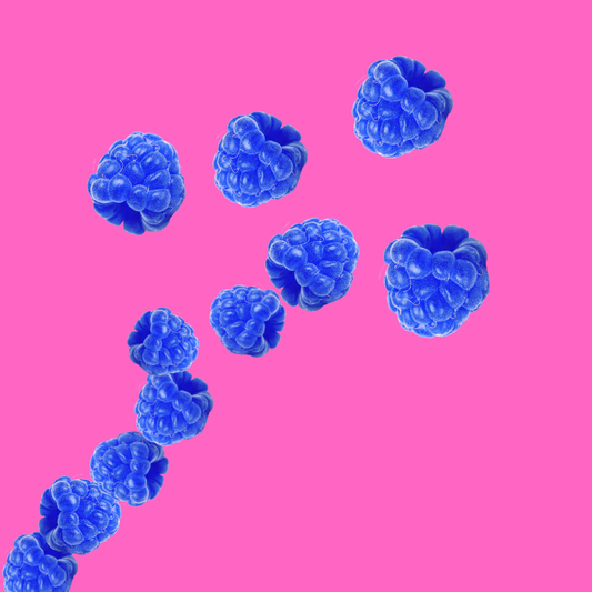 Blue raspberries on a pink background representing Hypothermias Blue Raspberry Sugar Free Dye-FREE Slush Syrup, a keto-friendly slush mix with zero net carbs for slush machines and frozen drinks