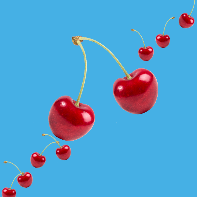 Fresh red cherries on a vibrant sky blue background representing Hypothermias Cherry SUGAR FREE | Dye-FREE Shaved Ice Syrup. Sweet & tart cherry flavor, sugar free, dye free, keto-friendly, made with monk fruit & erythritol.
