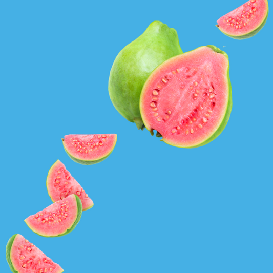 Fresh guava slices on a vibrant sky blue background representing Guava SUGAR FREE | Dye-FREE Shaved Ice & Snow Cone Syrup. Fruity tropical flavor, FREE & Clear, zero net carbs, sugar free, keto-friendly with monk fruit & erythritol.