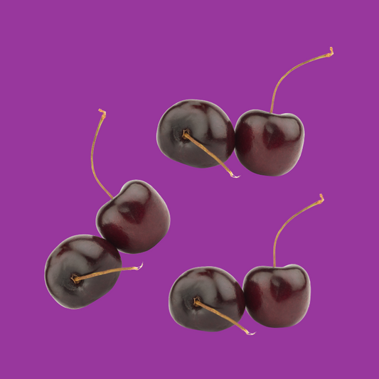 Ripe black cherries representing Hypothermias Dye-FREE Black Cherry Slush Syrup, made with non-GMO 100% pure cane sugar, no artificial colors and no dyes.