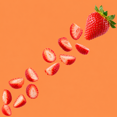 Fresh whole strawberry and sliced strawberries floating on an orange background, representing Hypothermias Natural Strawberry Flavor Concentrate for snow cones and shaved ice.