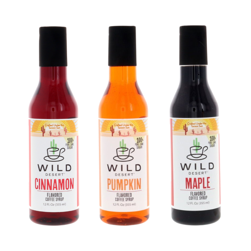 Three 12 fl. oz bottles of Wild Desert Coffee Syrups gift set in Cinnamon, Pumpkin, and Maple on a white background, made with pure cane sugar, non-GMO, no corn syrup, crafted in Tucson, Arizona, USA, with free shipping included.