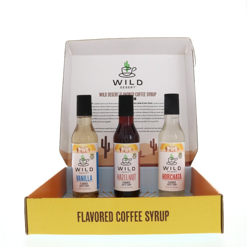 Wild Desert gourmet coffee syrup gift set of three flavors - Vanilla, Hazelnut, Horchata present in gift set box.